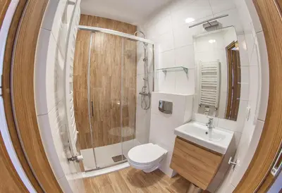 a bathroom with a toilet and a shower and a sink at Willa-Wita in Kalwaria Zebrzydowska