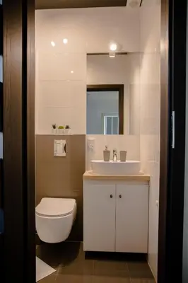 a bathroom with a white toilet and a sink at ULMA studio in Wieliczka