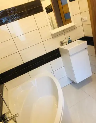 a bathroom with a toilet and a sink at Joanna in Kraków