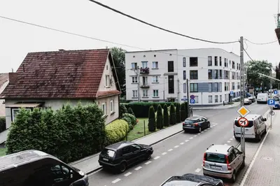 a view of a street with cars and buildings at Joanna in Kraków