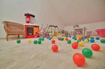 a room with a bunch of balls on the floor at Zielona willa in Rabka