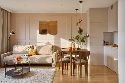 a living room with a couch and a table at Polka Apartment 2-bed in Kraków