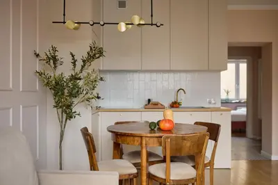a kitchen with a table with fruit on it at Polka Apartment 2-bed in Kraków