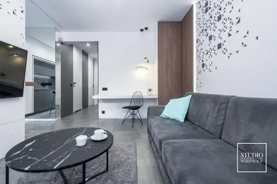 a living room with a couch and a table at Apartamenty Premium New in Wadowice