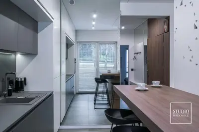 a kitchen with a wooden counter top in a room at Apartamenty Premium New in Wadowice