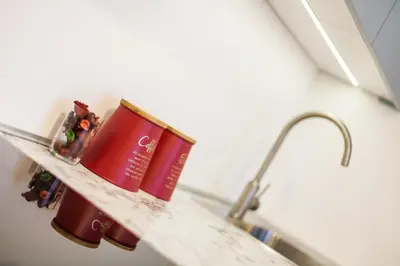 a shelf in a bathroom with two books on it at Vintage Krasińskiego 7/4 Apartment in Kraków