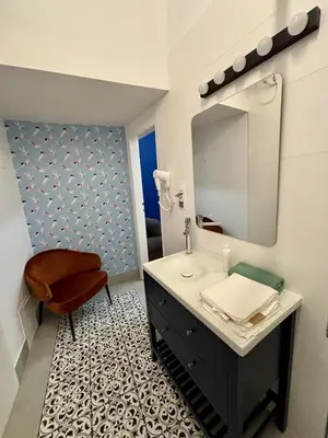 a living room with a couch and a table at Roller Aparthotel in Kraków