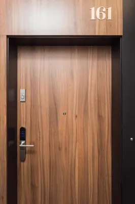 a wooden door with the number on it at City of the Kings - Nubium Apartment in Kraków