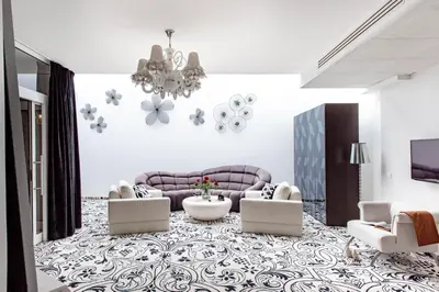 a bedroom with a bed with two pillows on it at Hotel Lenart in Wieliczka