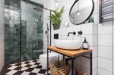 a bathroom with a sink and a toilet and a shower at City of the Kings - Botany Bay Apartment in Kraków