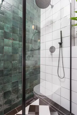 a bathroom with a shower with a glass door at City of the Kings - Botany Bay Apartment in Kraków