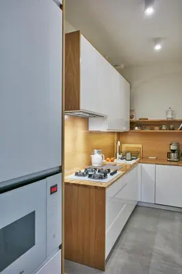 a kitchen with white cabinets and a stove top oven at Stylish apartment in Krakow - Old Town in Kraków