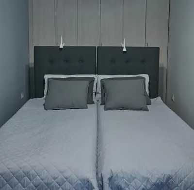 a large white bed with two pillows in a bedroom at Stylish apartment in Krakow - Old Town in Kraków