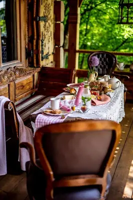 a table with food and drinks on top of it at Przystań 545 in Rożnów