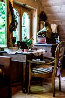 a kitchen with a wooden table with a laptop on it at Przystań 545 in Rożnów