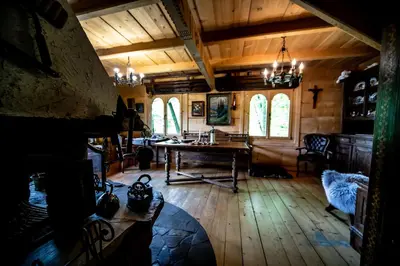 a room with a table and chairs in a building at Przystań 545 in Rożnów
