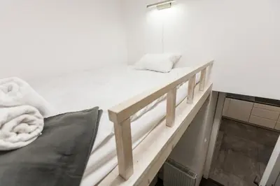 a bunk bed in a room with a mattress at Vintage Tomasza Apartment in Kraków