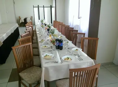 a long table with plates of food on it at Arka Kraków in Kraków