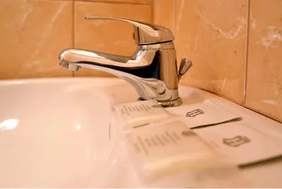 a sink with a faucet in a bathroom at Arka Kraków in Kraków
