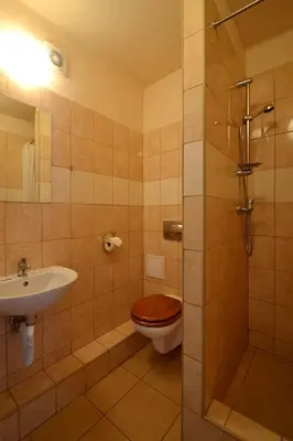 a bathroom with a toilet and a sink at Arka Kraków in Kraków