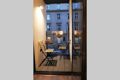 a balcony with a view of a building at BOUTIQUE 109 - old city, luxury apt. with a garage in Kraków