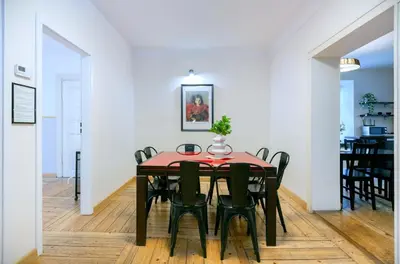 a dining room with a table and chairs at Prime Location Apartment in Kraków