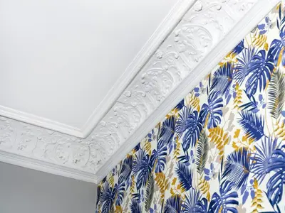 a room with a white ceiling with blue and yellow curtains at CracWoW Old Town Apartment in Kraków