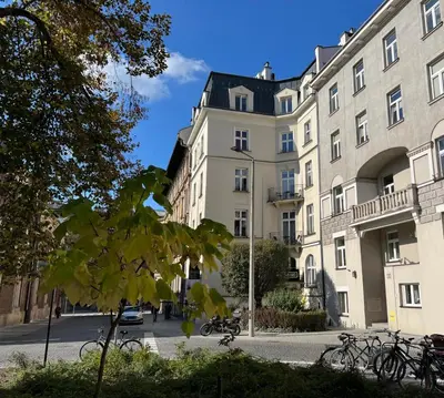 a building with bikes parked in front of it at Yourplace Romantic Apartment with private patio in Kraków