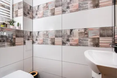 a bathroom with a sink and a toilet at Classy Old Town Apartment - by Upstairs in Kraków