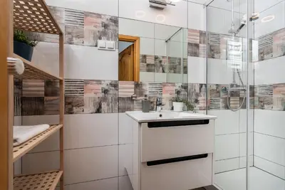 a bathroom with a sink and a shower at Classy Old Town Apartment - by Upstairs in Kraków