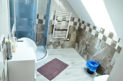 a bathroom with a shower and a sink at Pokoje gościnne u Grażki in Jerzmanowice