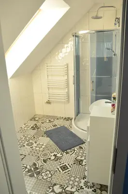 a bathroom with a shower and a sink and a toilet at Pokoje gościnne u Grażki in Jerzmanowice