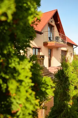 a white house with a red roof at Pokoje gościnne u Grażki in Jerzmanowice