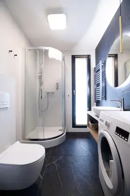 a bathroom with a shower and a toilet and a sink at Aparthotel Inspire Miodova Residence in Kraków