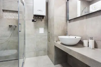 a bathroom with a sink and a shower at InPoint Krupnicza Apartment - 5 minut from Main Square Self Check-in in Kraków