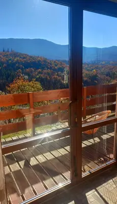 a view from a balcony with a glass door at Gazdówka na Mosornym Groniu in Zawoja