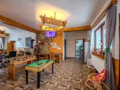 a bedroom with a bed and a large window at Gazdówka na Mosornym Groniu in Zawoja