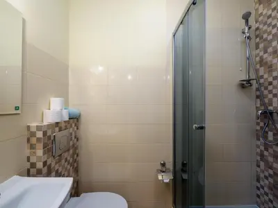 a bathroom with a shower with a toilet and a sink at Gazdówka na Mosornym Groniu in Zawoja