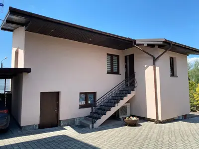 a house with a staircase on the side of it at Apartament Relax in Skawina