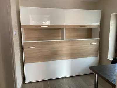 a large closet with wooden shelves and a table at Apartament Relax in Skawina
