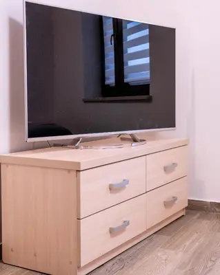 a bathroom sink with a large mirror on top of it at Apartament Relax in Skawina