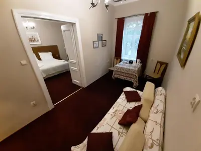 a living room with a couch and a bed at Red Carpet Premium in Kraków