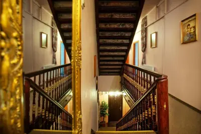 a spiral staircase in a building with a mirror at Red Carpet Premium in Kraków