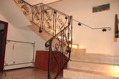 a spiral staircase in a home with a stair case at Agroturystyka Kasia in Podwilk