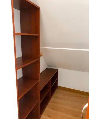 a built in book shelf in a room at Agroturystyka Kasia in Podwilk
