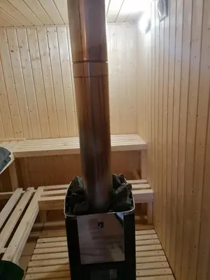 a inside of a sauna with a wood stove at Agroturystyka na szlaku in Lubomierz