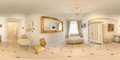 a living room with a mirror and a chair at Only Kraków Apartments in Kraków