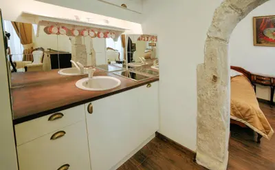a bathroom with two sinks and a mirror at Only Kraków Apartments in Kraków