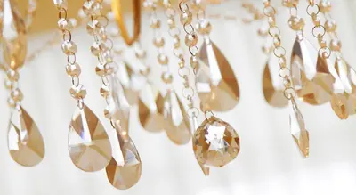 a bunch of silver necklaces hanging on a wall at Only Kraków Apartments in Kraków