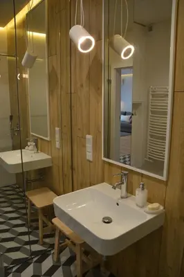 a bathroom with two sinks and a mirror at Last Floor Apartment - Krakow City Center close to Old Town in Kraków